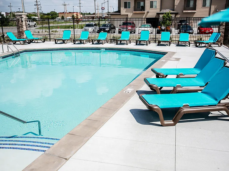 Luxury pool at The Sterling Grand Island with seating.