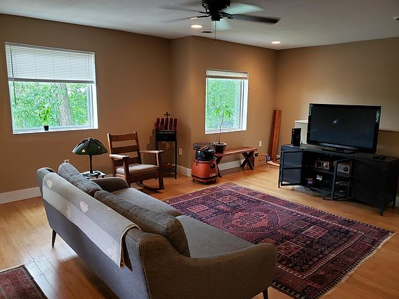 Open, spacious living room facing southeast. Furnished to reference size.