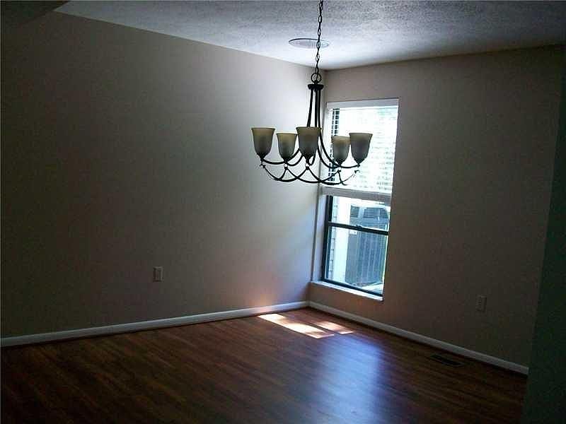 Spacious dining room with 2 windows for light and views of backyard connects directly to kitchen
