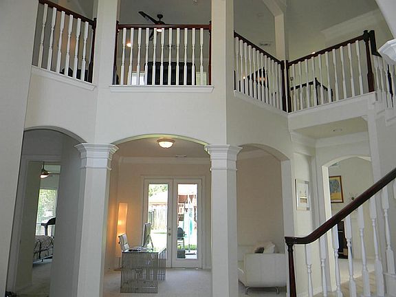 IMPRESSIVE FOYER WITH SOARING CEILINGS.