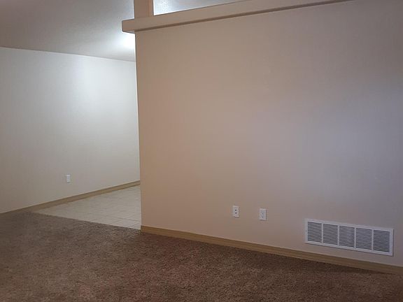 living opens to tiled dining room area