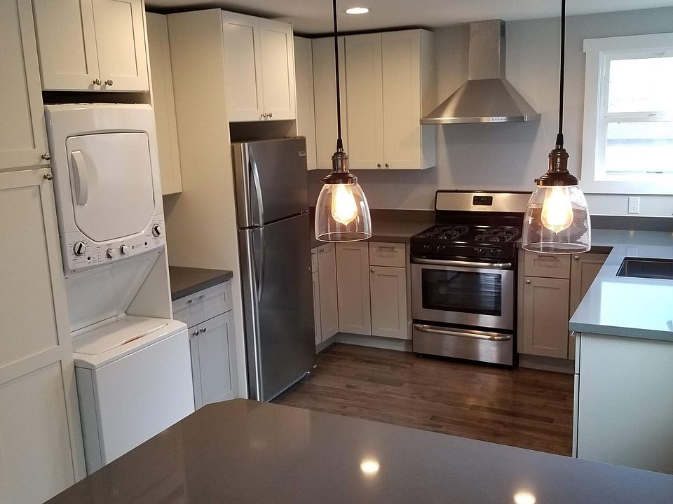 Kitchen with washer and dryer.