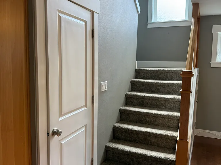 Stairs, door to laundry room