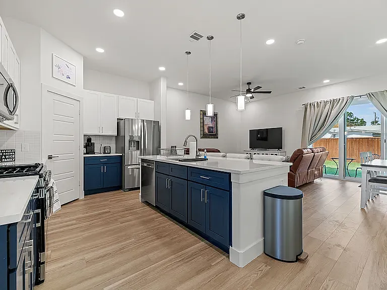 Chef's will love this kitchen with stainless steel appliances, loads of counter space, and a walk-in corner pantry.