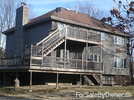 Two story deck, side raised patio / deck : 9 ft. upper and 6 ft. mid floor sliding patio doors two 1