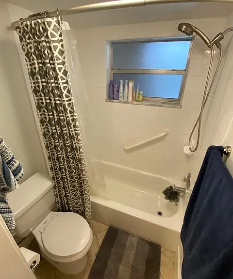 A pocket door saves space and affords privacy for the bathroom.