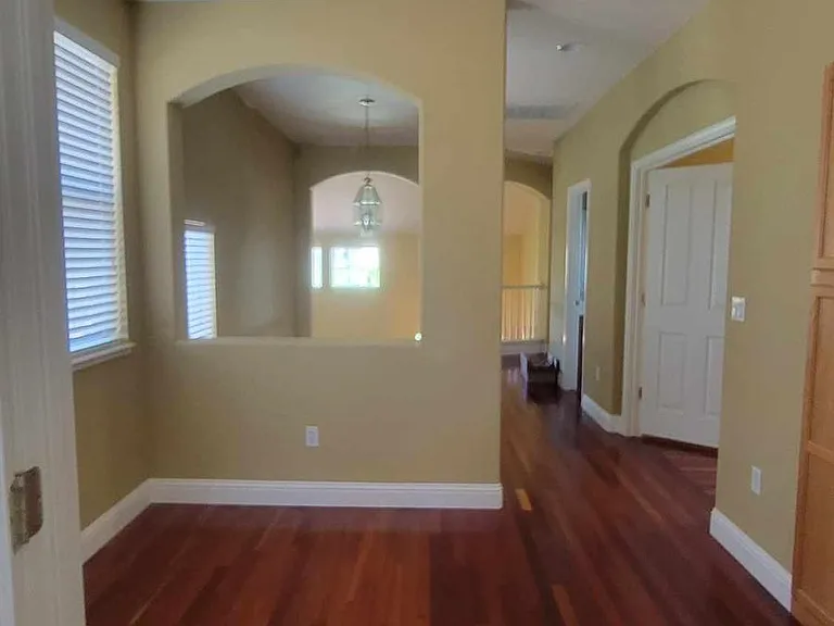 Looking out from master bedroom, small play area or space for a couch. 3rd and 4th bedroom on the right and at end of hall