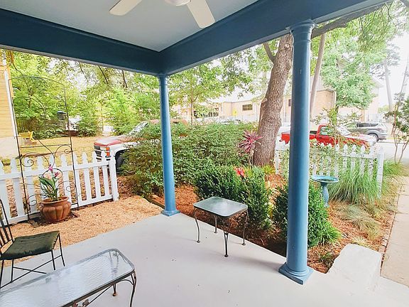 Cosy shared front porch to watch the world go by.