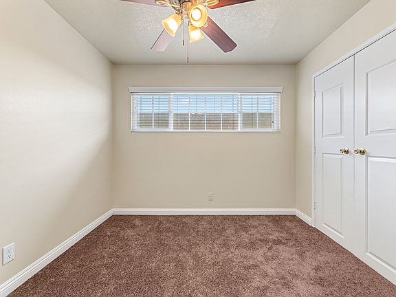 One of three bedrooms newly carpeted upscale base boards.