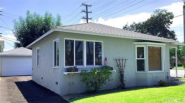 Nice big windows provide a lot of light. The long drive way and two car garage offer lots of parking. The front and back lawns h