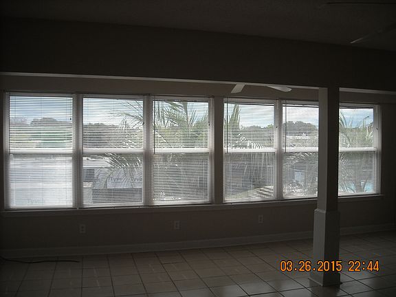 Great room with windows overlooking the pool.