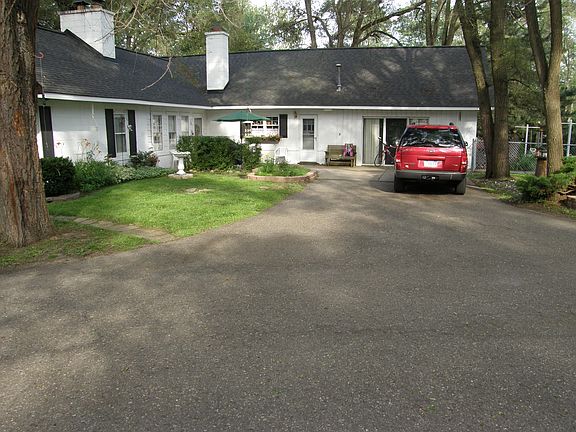Large parking area in rear.