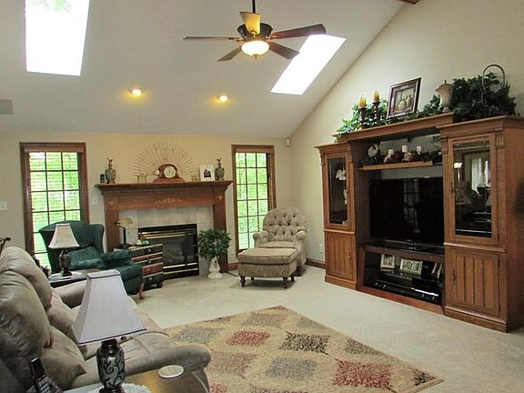 Great room with vaulted ceilings & sky lights!