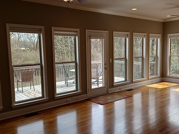 Optional 300+ sq ft Sunroom faces East for morning sun. Pull down cellular shades.
