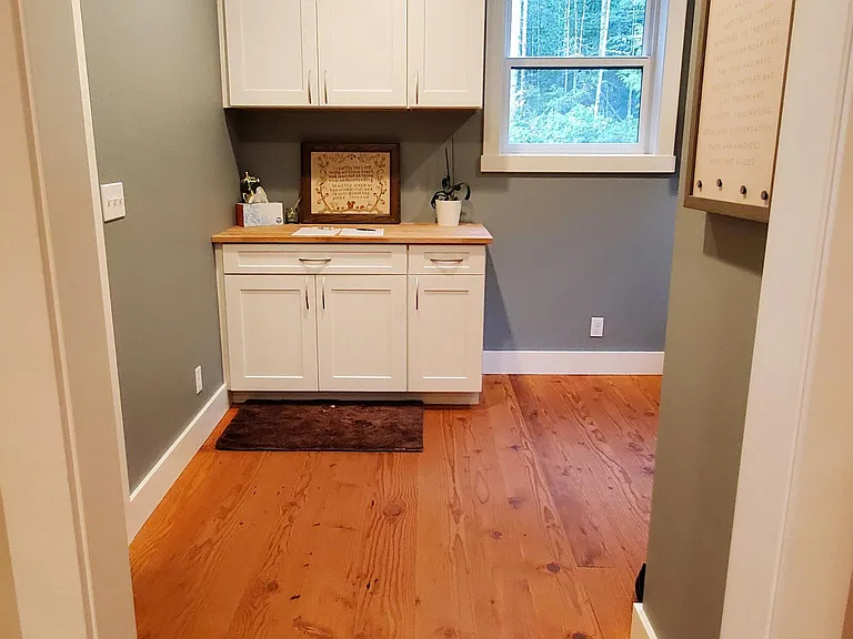The mudroom is located between the garage and living area, providing the perfect drop spot and keeping the other areas of the home organized.