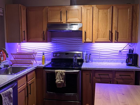 modern kitchen with stainless appliances and kitchen island