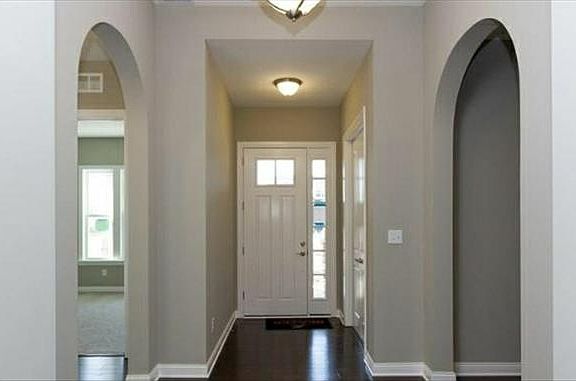 Foyer with 10 foot ceilings and hardwoods