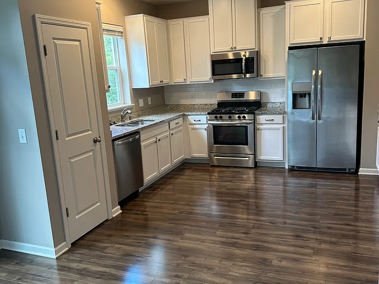 Kitchen on main level with stainless steel appliances. Nice storage throughout.