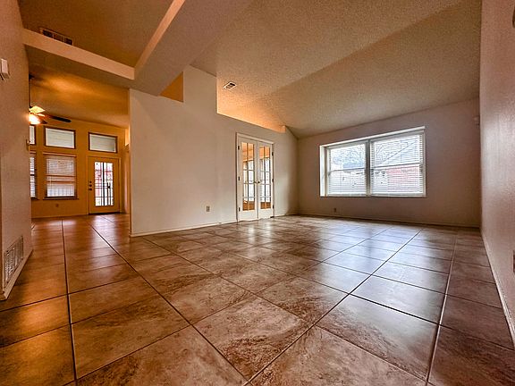 Living room with entry door to the dining room and hallway to the family room.