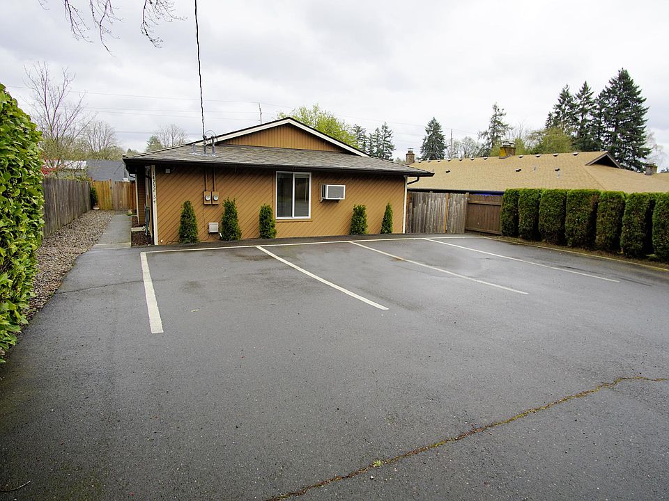 The offered apartment is in the front; the tenant gets the 2 right hand extra deep parking spots