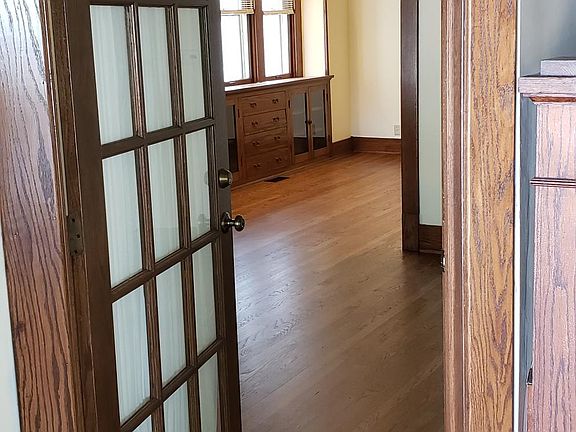 Shared foyer into the living room. Dining room beyond.