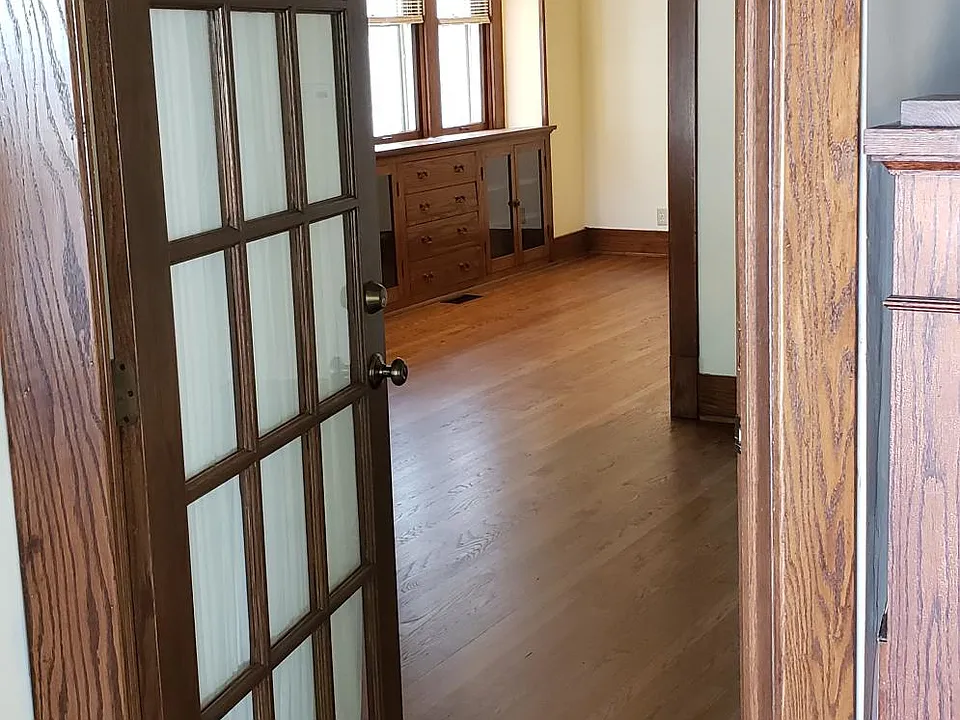 Shared foyer into the living room. Dining room beyond.