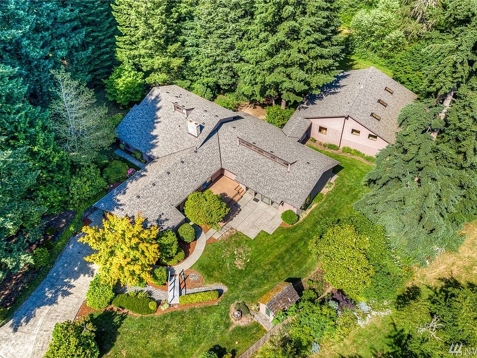 Your massive, secluded estate in the woods! Includes three (3) building with limitless potential!