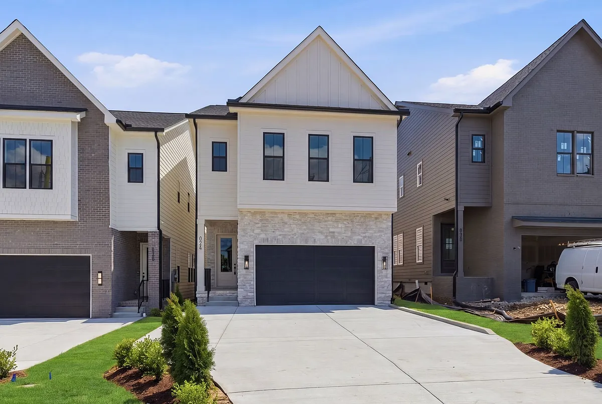 Front Exterior, driveway with two car garage. - 602A Croley Dr