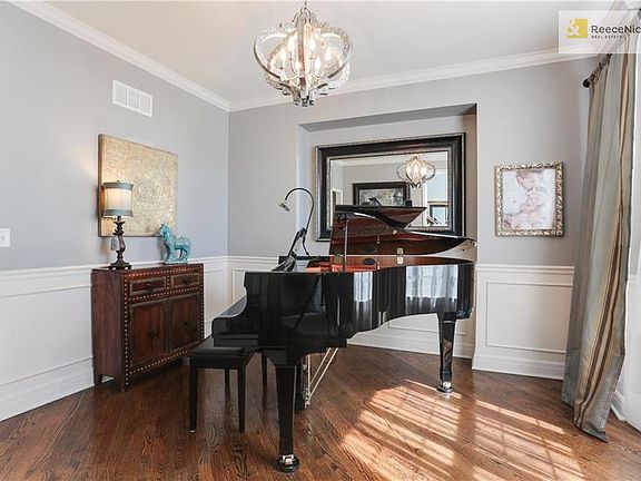 To the right of the two-story, light-filled entryway you'll find the formal dining space, currently used as a music room.  Could also be used a library, sitting room, play space.