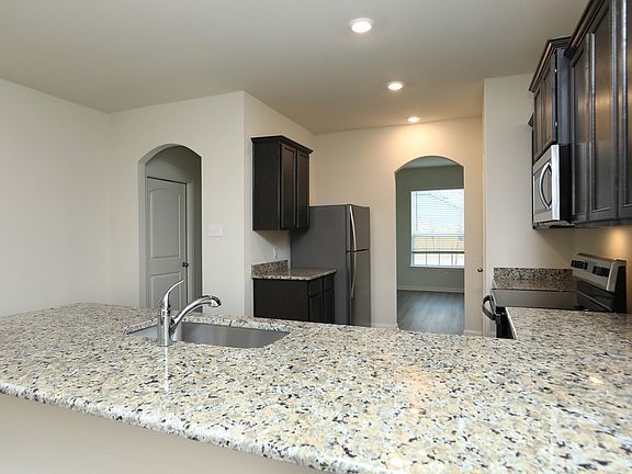 The chef ready kitchen comes with stainless steel appliances and granite countertops