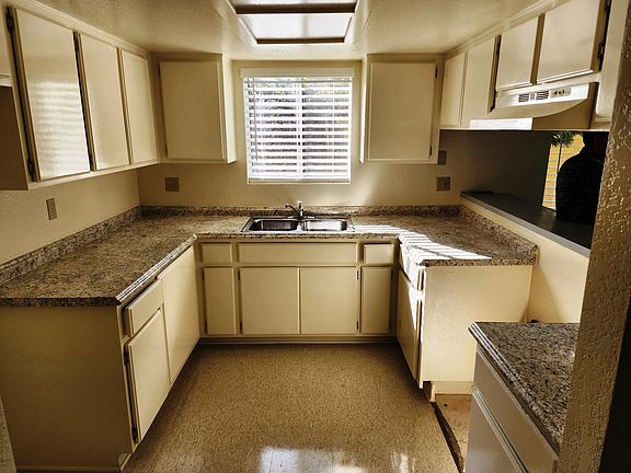 Kitchen with pass through to living room.