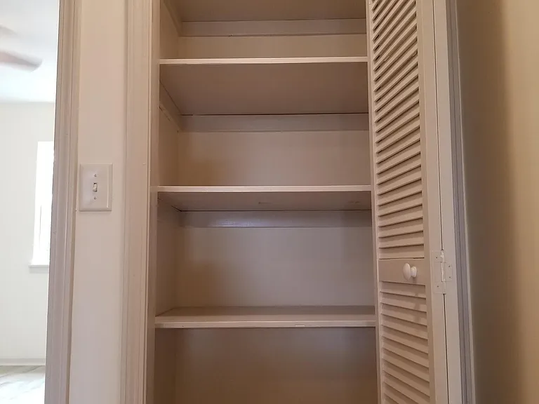Storage closet at top of stairs