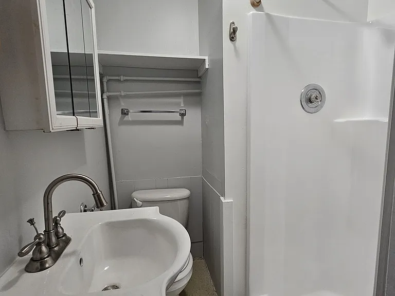 Unit C bathroom not in unit, a few feet away from Unit C entry.