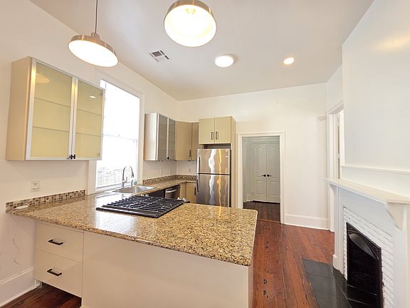 Kitchen with granite counter tops and island seating
