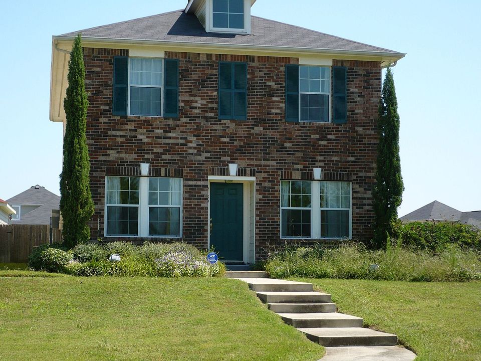 Front of the house opens up into a kid-friendly safe play area.