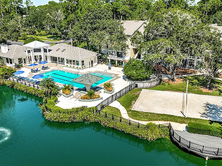 Resort Style Pool and Sand Volleyball Overlooking Lake