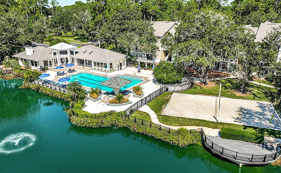 Resort Style Pool and Sand Volleyball Overlooking Lake