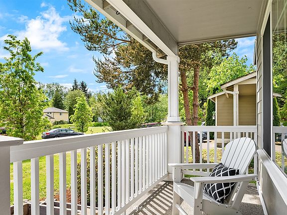 Quaint front porch with a view.
