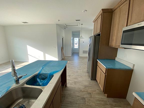 Kitchen - pendant lighting (not pictured), double sink, all brand new stainless steel kitchen appliances included (not pictured), matte black kitchen faucet and cabinet hardware (not pictured)
