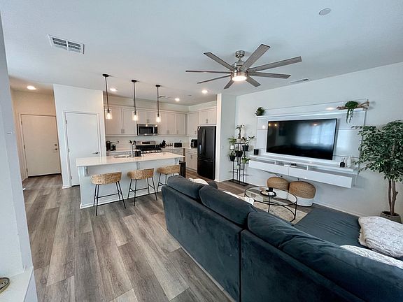 Downstairs, open concept. TV and entertainment center included