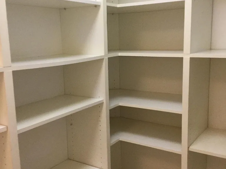 Custom built in shelving. Used for pantry & storage.