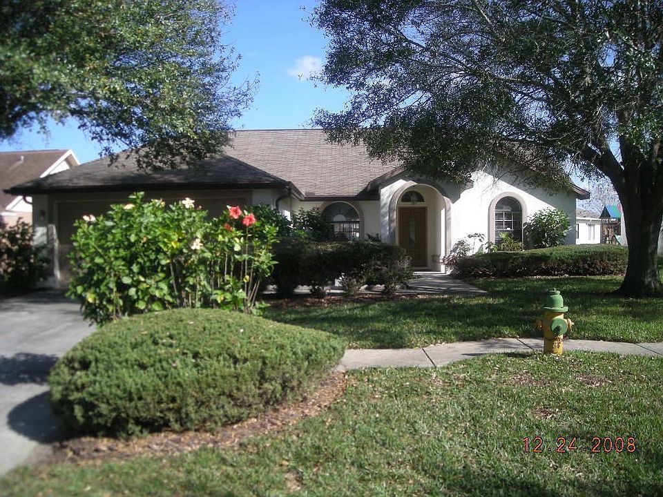 Front with mature landscape