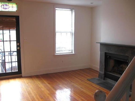 heart pine flooring and a working wood fireplace