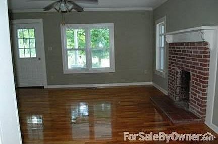 Living Room : Living Room has original hardwood floors, and original fireplace.