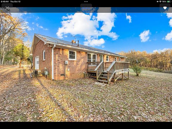 Rear view of house & rear deck with recently purchased gas grill_