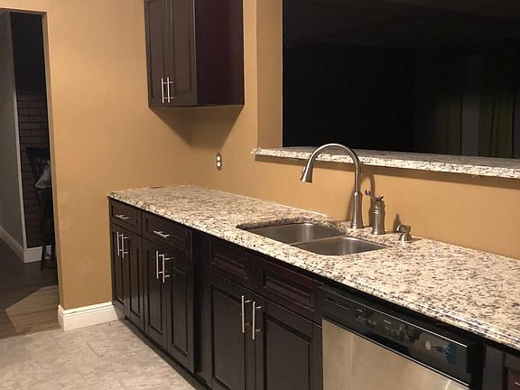 Kitchen with granite countertops Dishwasher to stay