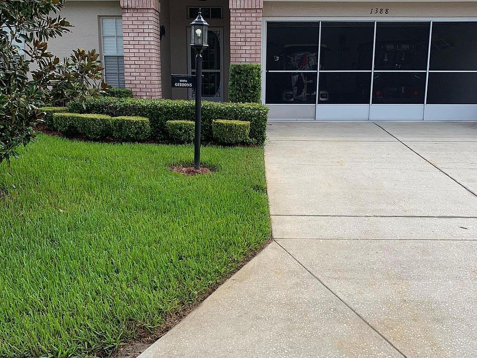 2 car garage with storage cabinets and screens to allow a nice breeze through the home.
