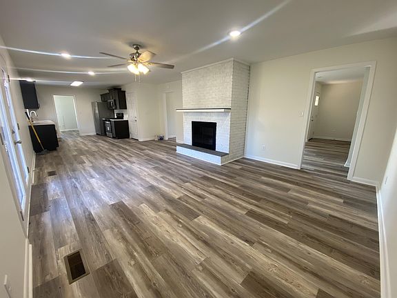 Open concept Kitchen and dining area. Fireplace is non-functioning.