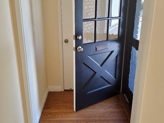 Coat closet behind the front door.