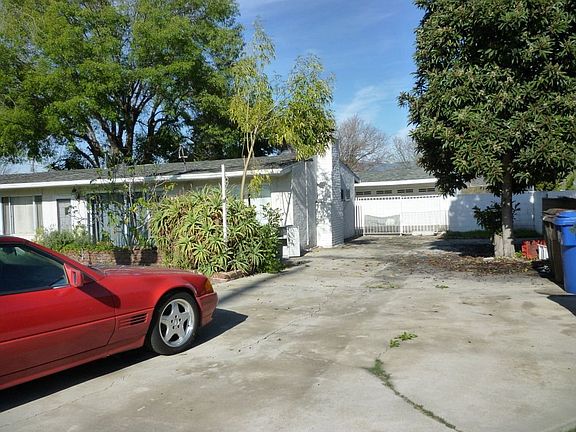 Driveway 1 of 2, Detached 2 car garage in rear behind house